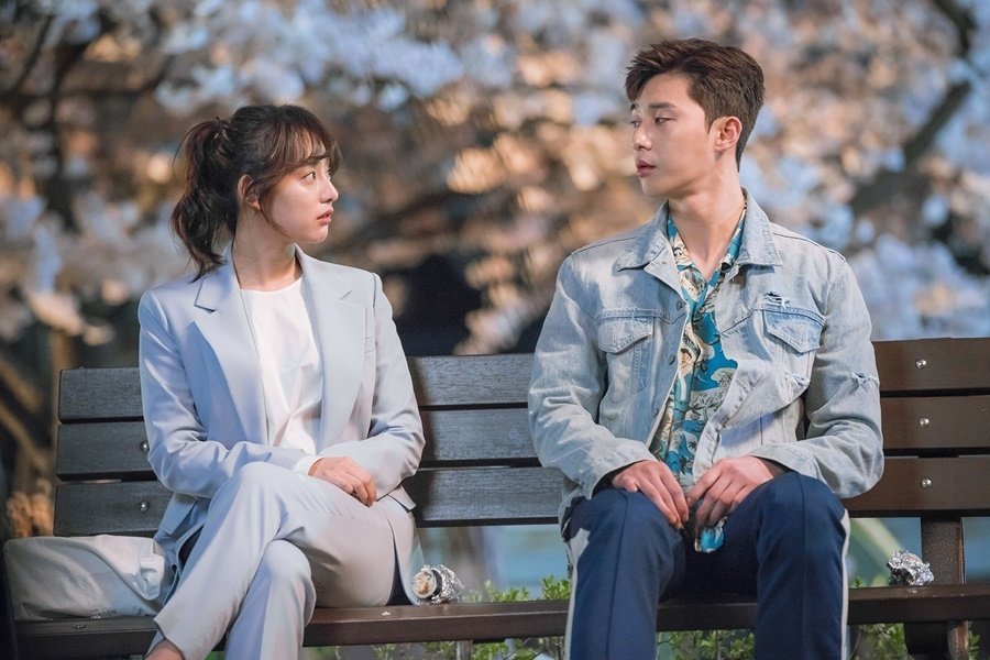 Fight for my way main couple sitting on a bench looking at each other