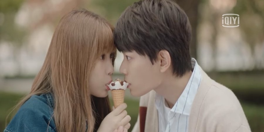 Two people sharing an Ice cream 