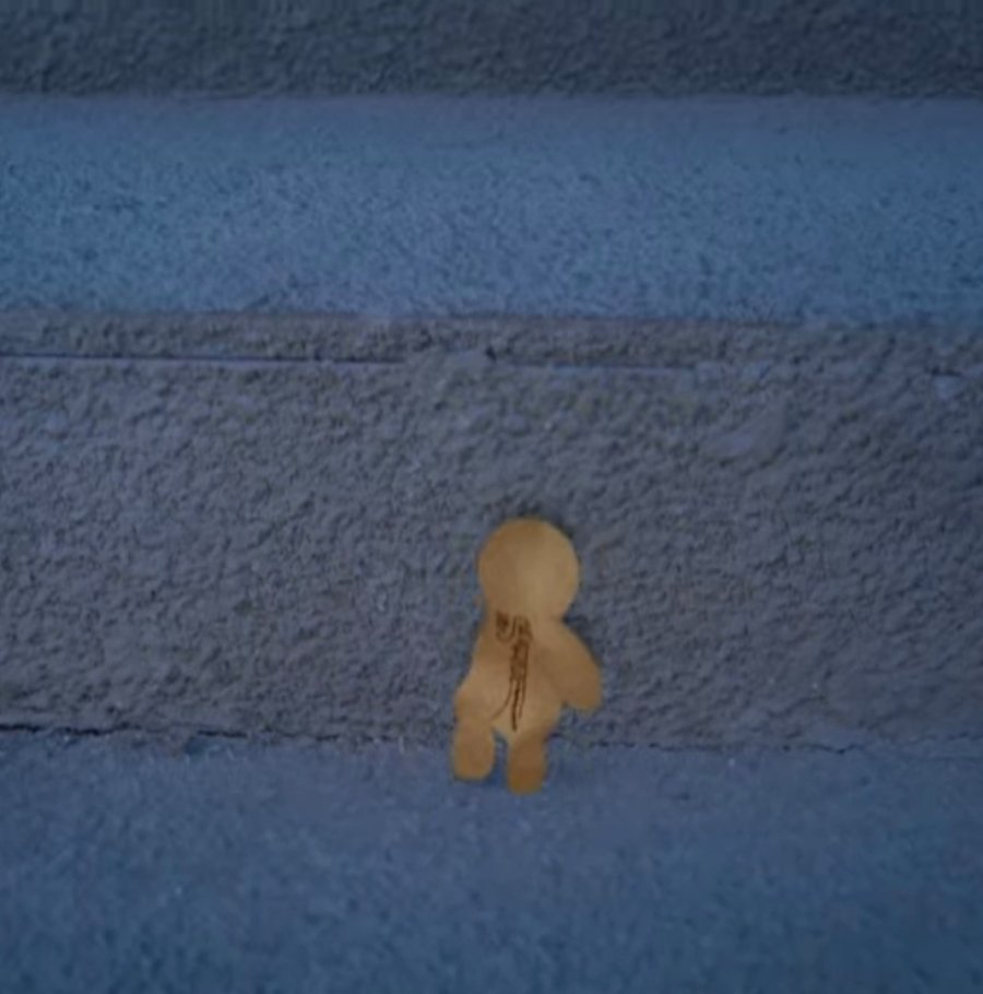 little paper figure going up some stairs 